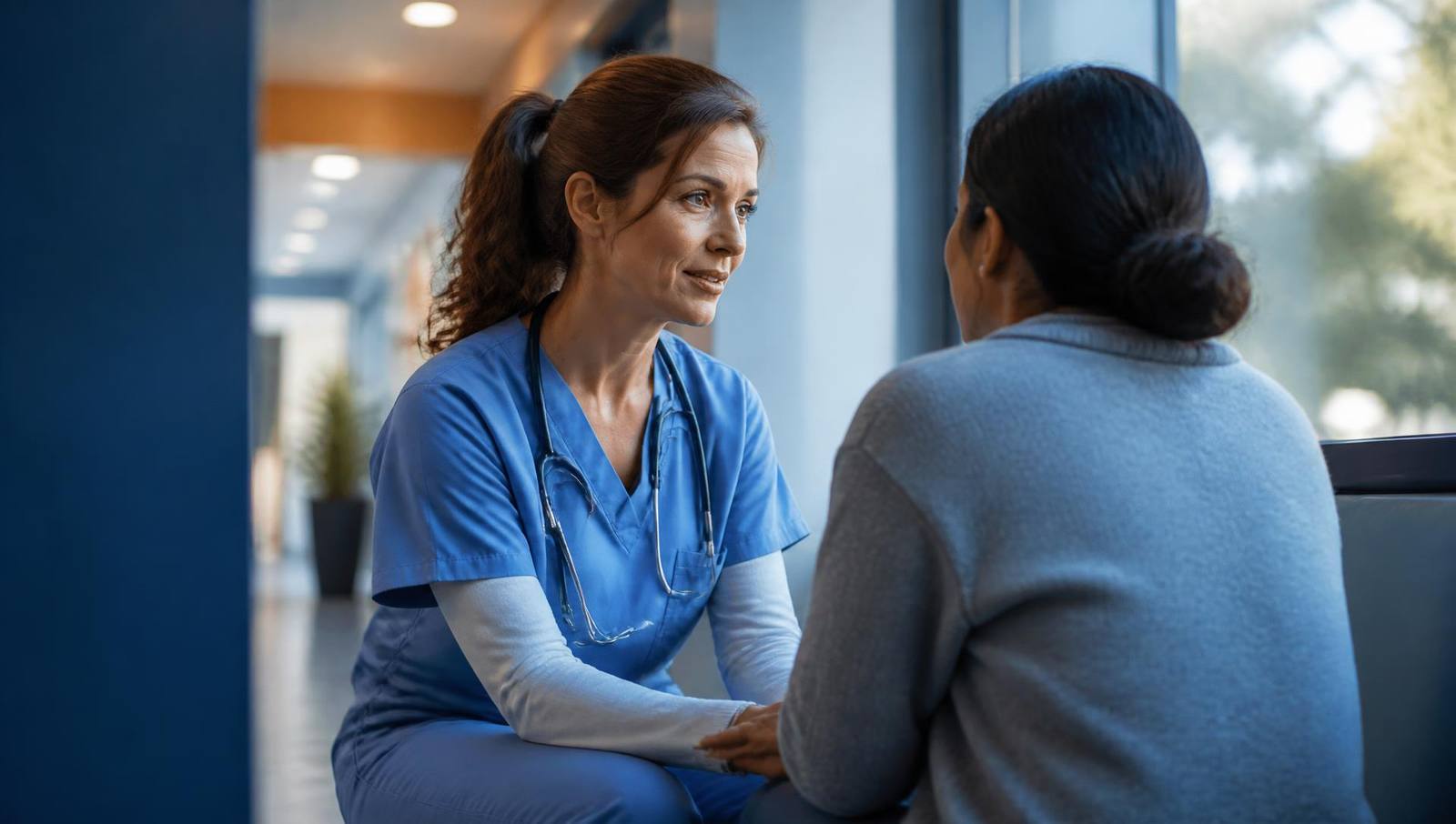 Illustration: a nurse speaking gently with a family member in a modern hospital
